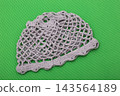 A knitted women's hat on a colorful background. 143564189