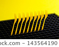 Abstract still life with yellow forks 143564190