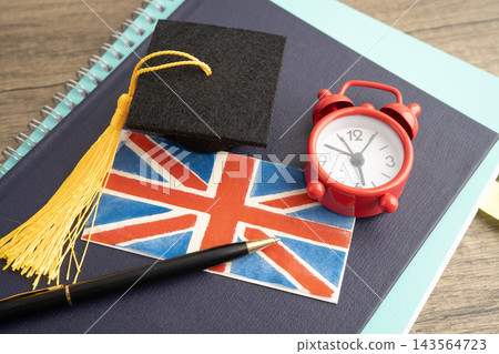Time to learn English language, book with uk flag. Time to learn English language, book with uk flag. 143564723