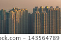 Hong Kong Oct 11 2026 high rise residential apartment facades glowing in light 143564789
