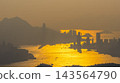 Hong Kong Oct 11 2026 across golden Victoria Harbour water channel 143564790