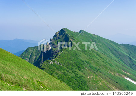 Mount Tanigawa viewed from Ichinokura-dake, along the Tanigawadake Horseshoe Traverse Trail in Minakami Town, Gunma Prefecture. Mount Tanigawa viewed from Ichinokura-dake, along the Tanigawadake Horseshoe Traverse Trail in Minakami Town, Gunma Prefecture. 143565249