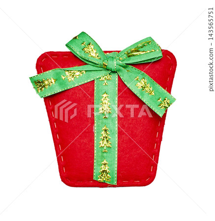Red felt gift box Christmas ornament with green ribbon and tree pattern on a white background. Red felt gift box Christmas ornament with green ribbon and tree pattern on a white background. 143565751