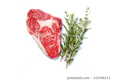 Marbled raw steak arranged for barbecue cooking - on parchment paper 143566213