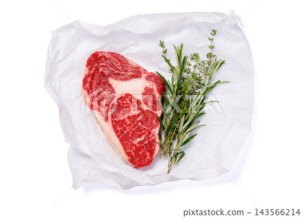 Butcher cut beef with salt pepper and fresh thyme - on parchment paper 143566214