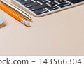 Office supplies on beige desk 143566304