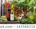 Wine Bottles and Grapes with Garden Copy Space 143566318