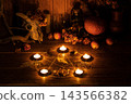 High angle view of authentic mystical witchy altar set with pentagram, candles and offerings, film grain 143566382