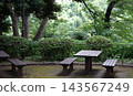 Benches in a rest area surrounded by greenery 143567249