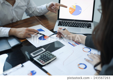 Businesspeople coworker reviewing document report together in the meeting room Businesspeople coworker reviewing document report together in the meeting room 143567263