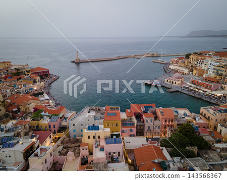 Old Venetian Harbor of Rethymno, Crete. A scenic view of the Old Venetian Harbor in Rethymno, Crete, Greece. This historic port features charming waterfront tavernas, colorful boats, and a majestic li Old Venetian Harbor of Rethymno, Crete. A scenic view of the Old Venetian Harbor in Rethymno, Crete, Greece. This historic port features charming waterfront tavernas, colorful boats, and a majestic li 143568367