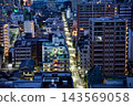 A bird's-eye view of the streets of Kinshicho and Oshiage, enveloped in the stillness of dawn, with streetlights still visible on the roads. 143569058