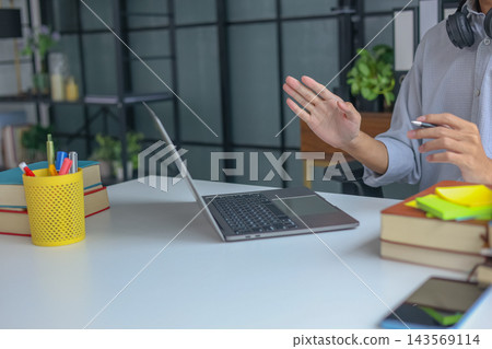 Close-up of male hands gesturing during online class or meeting communication. 143569114