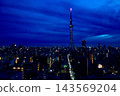 The blue sky at dawn and the illuminated Tokyo Skytree - a city night view from Kinshicho 143569204
