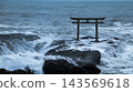 Torii gate swallowed by waves 143569618