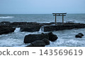 Torii gate swallowed by waves 143569619