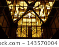 The illuminated truss structure and riveted steel beauty viewed from behind the piers of the Kuramae Bridge on the Sumida River. 143570004