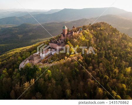 Aerial panoramic castle with expansive valley and mountain layers. Castle Haut-Koenigsbourg, Alsace, France - April 10, 2026 - Aerial panoramic castle with expansive valley and mountain layers, docume Aerial panoramic castle with expansive valley and mountain layers. Castle Haut-Koenigsbourg, Alsace, France - April 10, 2026 - Aerial panoramic castle with expansive valley and mountain layers, docume 143570862
