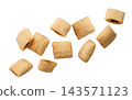 Cereal pads flying close-up a white background. Isolated 143571123