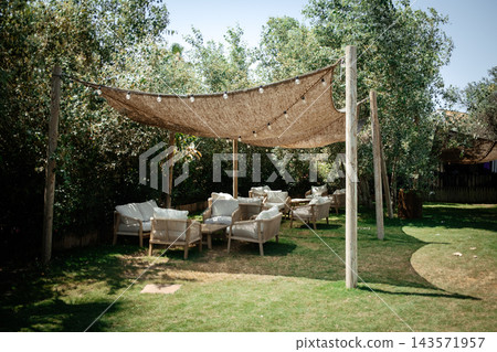 Outdoor chill-out area at a music event venue with shadow Outdoor chill-out area at a music event venue with shadow 143571957
