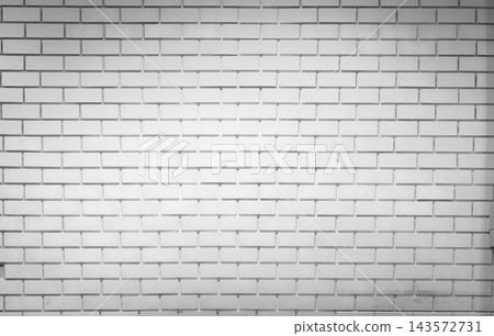 White brick wall with staggered rows of rectangular bricks and narrow gray joints, a textured architectural surface for home interiors with subtle marks and wear along the lower rows. White brick wall with staggered rows of rectangular bricks and narrow gray joints, a textured architectural surface for home interiors with subtle marks and wear along the lower rows. 143572731