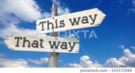 This way, that way - wooden signpost with two arrows This way, that way - wooden signpost with two arrows 143572986