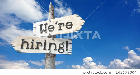 We are hiring - wooden signpost with two arrows We are hiring - wooden signpost with two arrows 143573004