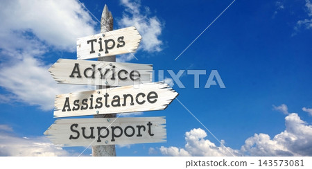 Tips, advice, assistance, support - wooden signpost with four arrows Tips, advice, assistance, support - wooden signpost with four arrows 143573081