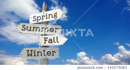 Spring, Summer, Fall, Winter - wooden signpost with four arrows Spring, Summer, Fall, Winter - wooden signpost with four arrows 143573083
