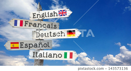 English, French, German, Spanish, Italian - wooden signpost with five arrows English, French, German, Spanish, Italian - wooden signpost with five arrows 143573136
