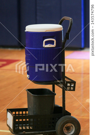 Water Cooler on a Cart in a Gymnasium Water Cooler on a Cart in a Gymnasium 143574796