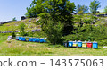 Colorful Beehives In A Sunny Rural Meadow Near Trees On A Rocky Hillside Apiary 143575063