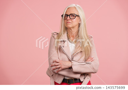 Senior woman expressing confidence and active maturity Senior woman expressing confidence and active maturity 143575699