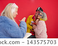 Seniors celebrating wedding and active maturity with colorful clothing 143575703