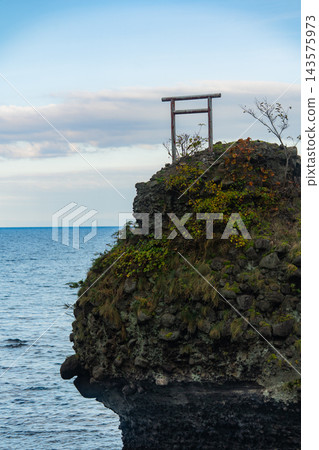 A view of the torii gate standing on Daikoku Rock in Yoichi and the blue sea. A view of the torii gate standing on Daikoku Rock in Yoichi and the blue sea. 143575973