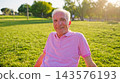 Senior man smiling enjoying retired healthy lifestyle in park 143576193