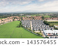 Aerial view of housing estates beside rice fields in San Sai, Chiang Mai, Thailand 143576455