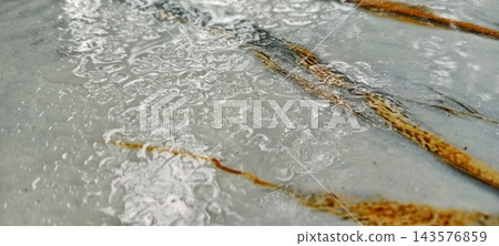 Rainwater Ripples And Bubbles On Marble Table Surface 143576859