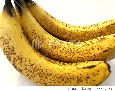 Three bananas that were overripe and had lots of sugar spots. Three bananas that were overripe and had lots of sugar spots. 143577233
