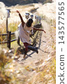 Woman jumping in nature 143577565