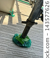 Scaffolding and jack base fixing points during exterior wall painting work 143577626