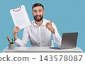 Happy Caucasian guy holding resume and showing thumb up gesture at his desk, blue studio background. HR manager finding perfect worker for business team. Successful employment and headhunting concept 143578087