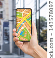 Woman Hand Holding Smartphone With Mobile Map On Screen, Using Gps System In Phone For Navigation In City, Tracking Location And Planning Routes, Creative Collage, Closeup 143578097