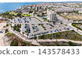 Aerial view of coastal parking lot and resort town 143578433