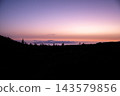 Violet afterglow above the cloud sea on Tenerife. Violet and peach afterglow spreads above the cloud sea seen from the high road in Teide National Park. Stillness and perspective for mindfulness  143579856