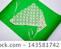 A knitted women's headscarf on a colorful background. 143581742