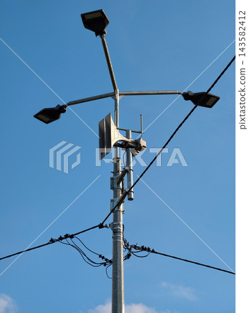 A siren designed to broadcast air raid alerts, providing crucial warnings to the population during military conflicts A siren designed to broadcast air raid alerts, providing crucial warnings to the population during military conflicts 143582412