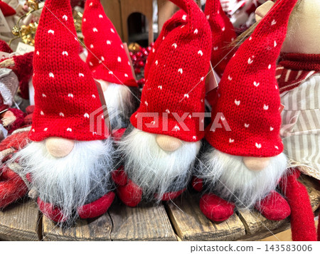 Traditional gnome figures with red knitted hats. Traditional gnome figures with red knitted hats. 143583006