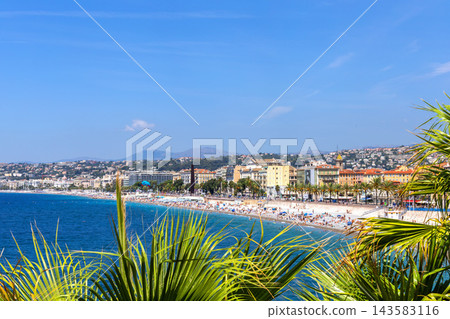 Sunny Nice coastline with colorful buildings and beach. Nice, France Sunny Nice coastline with colorful buildings and beach. Nice, France 143583116