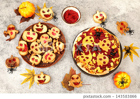 Scary pizza with tomatoes, sausages, ghosts and pumpkins made of cheese and olives on an old concrete background, cafe and menu advertising, restaurant business card, Halloween food concept, Scary pizza with tomatoes, sausages, ghosts and pumpkins made of cheese and olives on an old concrete background, cafe and menu advertising, restaurant business card, Halloween food concept, 143583866